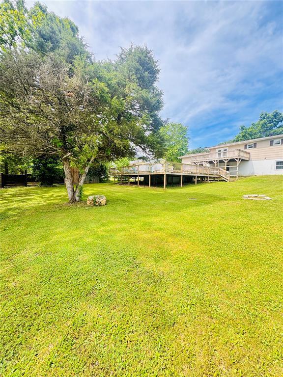 1202 S Mildred Ave, Salem, MO 65560 - view of green lawn featuring a deck