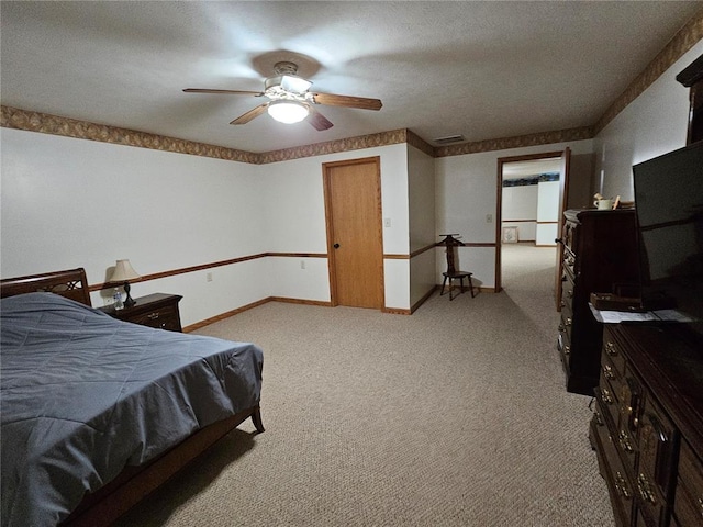 103 E Broad St, Raymond, IL 62560 - bedroom featuring light carpet, baseboards, a ceiling fan, and a textured ceiling