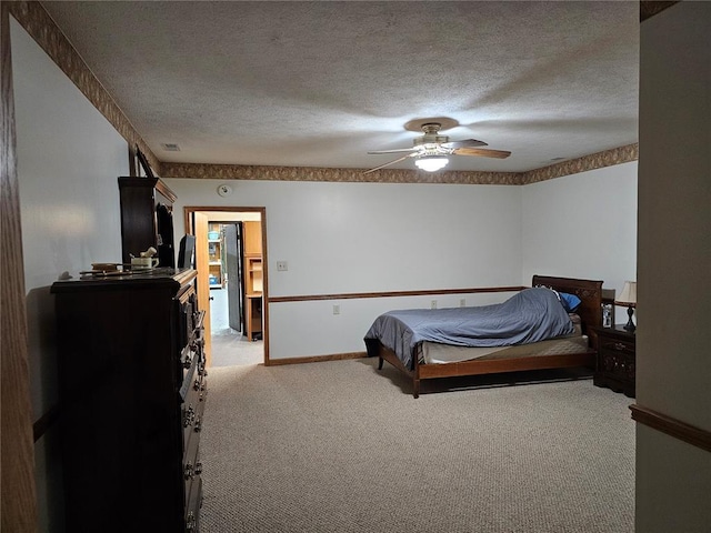 103 E Broad St, Raymond, IL 62560 - carpeted bedroom with a textured ceiling, ceiling fan, and baseboards