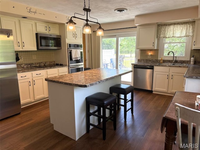414 Hillcrest Dr, Sullivan, MO 63080 - kitchen with appliances with stainless steel finishes, a sink, healthy amount of natural light, and white cabinetry