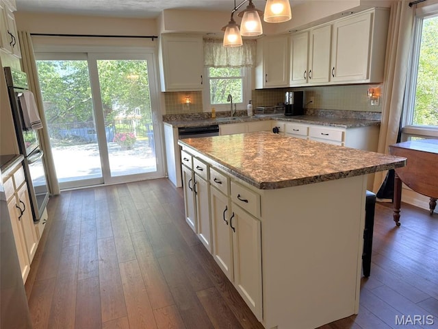 414 Hillcrest Dr, Sullivan, MO 63080 - kitchen with dark wood-style floors, white cabinets, backsplash, and a sink
