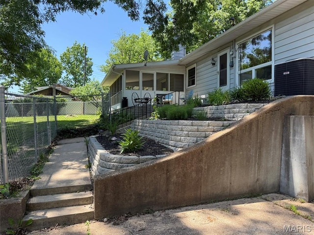 414 Hillcrest Dr, Sullivan, MO 63080 - view of patio featuring a sunroom and central AC unit