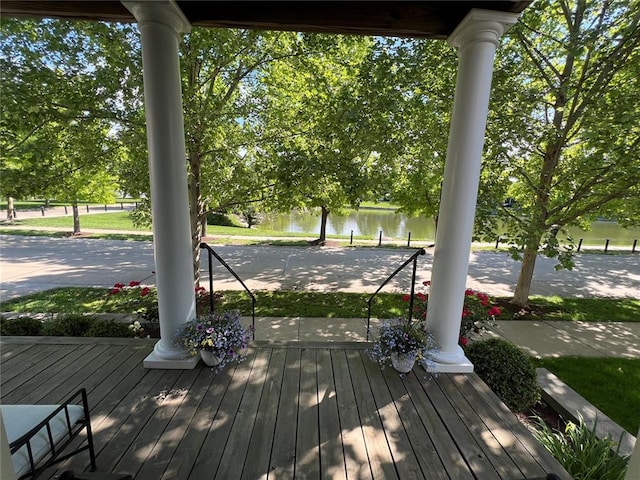 3481 New Town Lake Dr, Saint Charles, MO 63301 - wooden porch featuring a water view