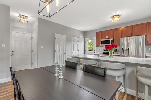 3481 New Town Lake Dr, Saint Charles, MO 63301 - dining area featuring light wood finished floors and baseboards