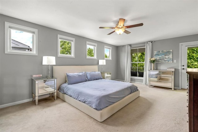3481 New Town Lake Dr, Saint Charles, MO 63301 - carpeted bedroom featuring baseboards, access to outside, and a ceiling fan