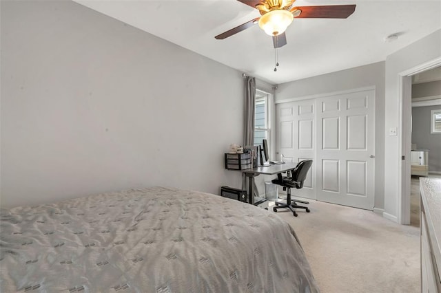 3481 New Town Lake Dr, Saint Charles, MO 63301 - carpeted bedroom featuring a closet, multiple windows, and ceiling fan