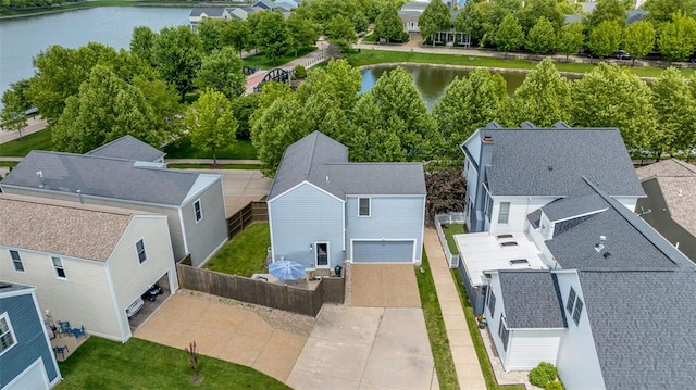 3481 New Town Lake Dr, Saint Charles, MO 63301 - aerial perspective of suburban area with a large body of water and a tree filled landscape