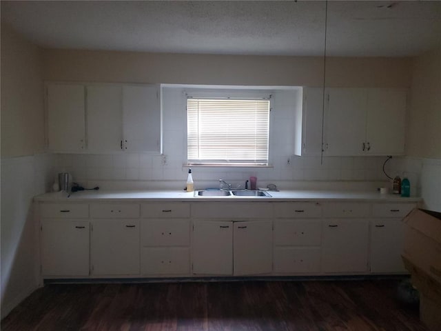 768 Leon St, Cahokia, IL 62206 - kitchen with a sink, white cabinets, and dark wood-style flooring