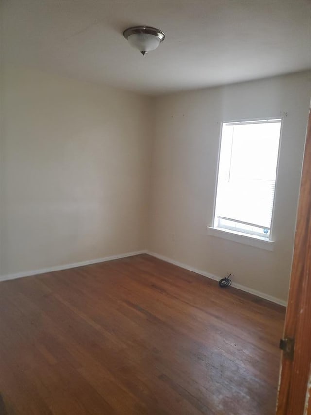 768 Leon St, Cahokia, IL 62206 - spare room featuring wood finished floors and baseboards