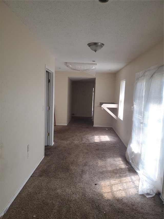 768 Leon St, Cahokia, IL 62206 - corridor with carpet flooring, a textured ceiling, and baseboards