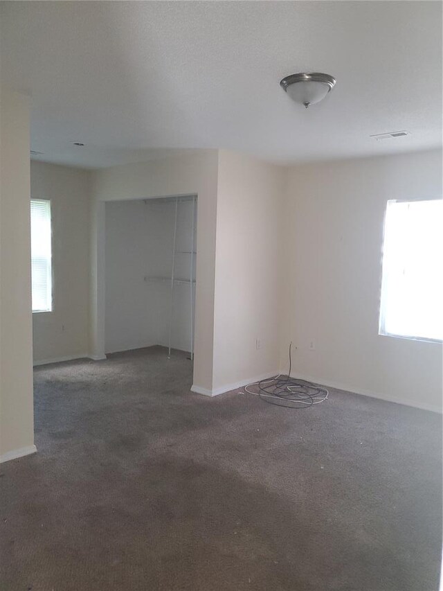 768 Leon St, Cahokia, IL 62206 - unfurnished room featuring healthy amount of natural light, carpet, and baseboards