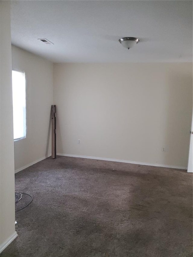 768 Leon St, Cahokia, IL 62206 - spare room featuring carpet and baseboards