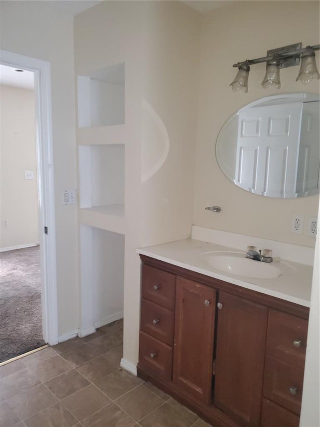 768 Leon St, Cahokia, IL 62206 - bathroom with vanity, baseboards, and tile patterned floors