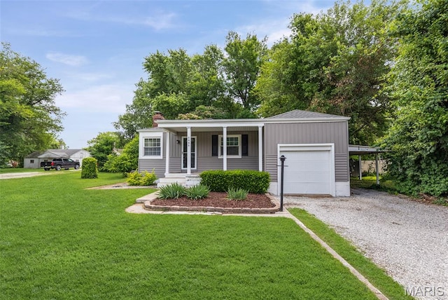 6446 Old Collinsville Rd, Ofallon, IL 62269 - ranch-style house featuring driveway, an attached garage, covered porch, and a front lawn