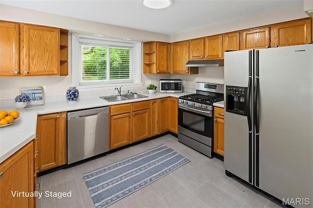 6446 Old Collinsville Rd, Ofallon, IL 62269 - kitchen with stainless steel appliances, open shelves, under cabinet range hood, and light countertops
