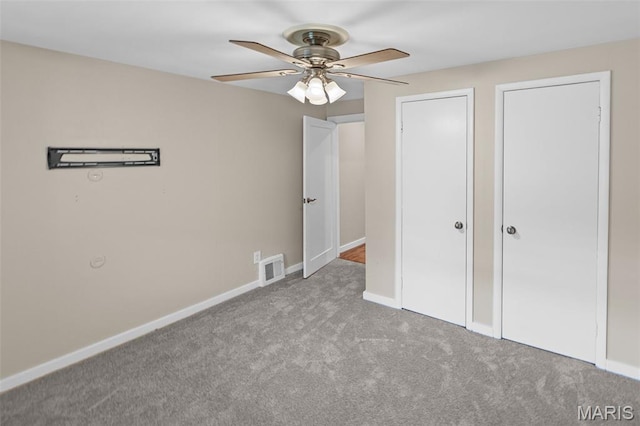 6446 Old Collinsville Rd, Ofallon, IL 62269 - unfurnished bedroom with carpet, ceiling fan, and two closets