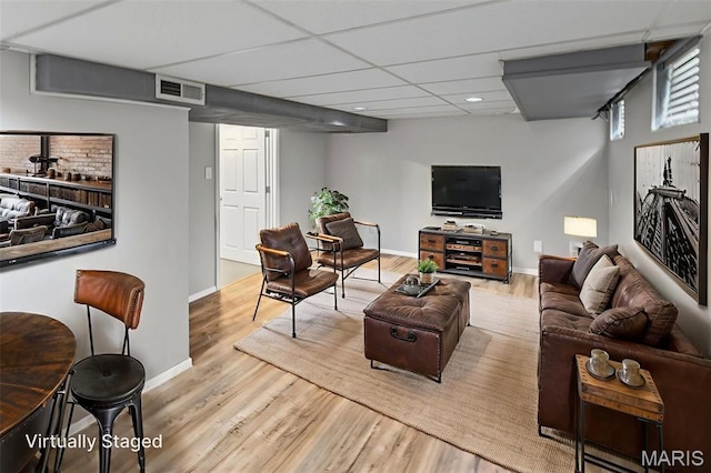 6446 Old Collinsville Rd, Ofallon, IL 62269 - living area featuring wood finished floors, recessed lighting, and a paneled ceiling