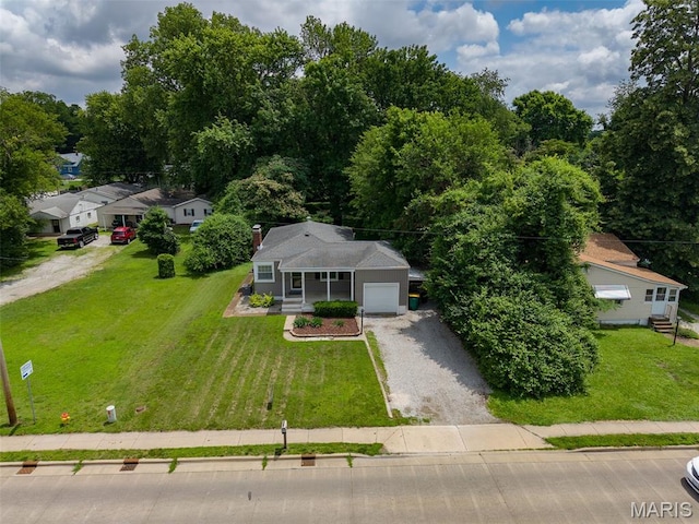 6446 Old Collinsville Rd, Ofallon, IL 62269 - view of front facade with driveway, an attached garage, a front yard, and covered porch