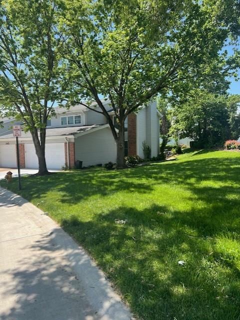 341 Fox Village Ct, Ballwin, MO 63021 - view of front of house featuring a front lawn and a garage