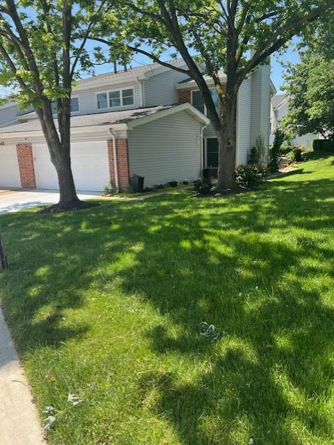 341 Fox Village Ct, Ballwin, MO 63021 - view of front of home with brick siding and a front lawn