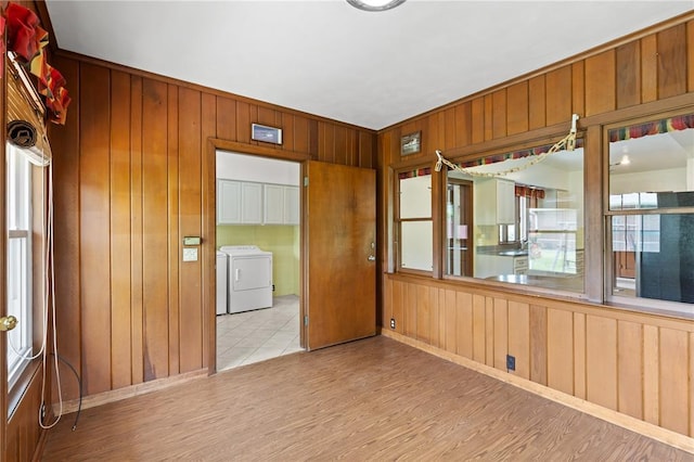 814 Pardee Rd, Godfrey, IL 62035 - unfurnished room with wooden walls, washing machine and clothes dryer, and wood finished floors