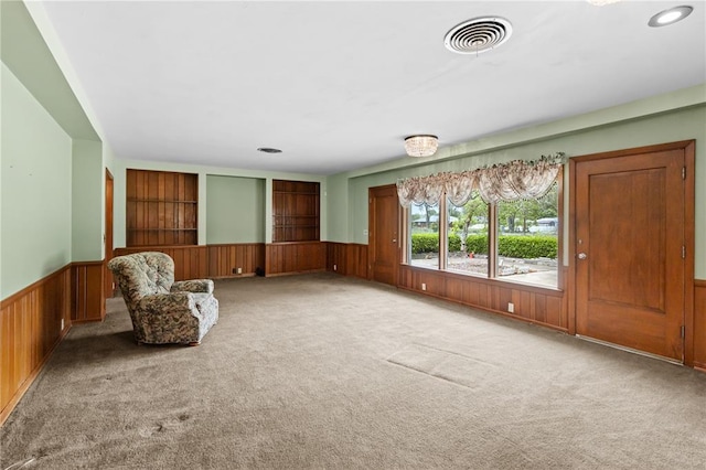 814 Pardee Rd, Godfrey, IL 62035 - unfurnished room with wainscoting, carpet floors, wood walls, and built in features