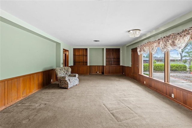 814 Pardee Rd, Godfrey, IL 62035 - unfurnished room with wooden walls, wainscoting, and carpet