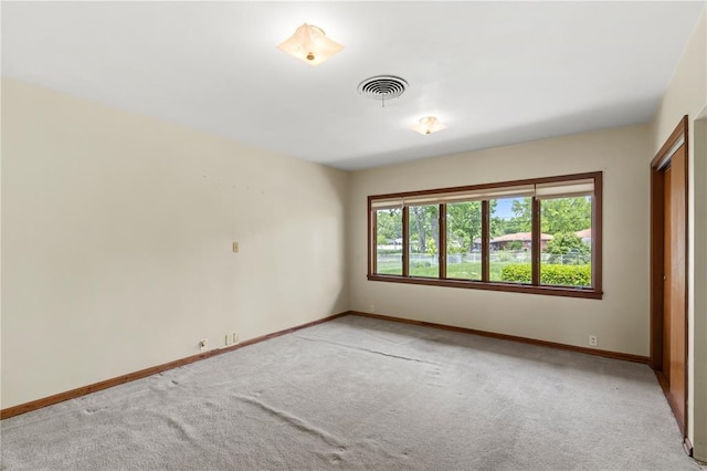 814 Pardee Rd, Godfrey, IL 62035 - spare room with baseboards and light colored carpet