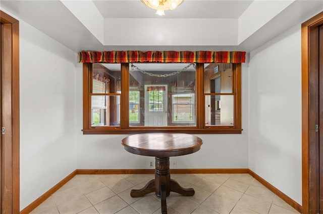 814 Pardee Rd, Godfrey, IL 62035 - unfurnished dining area with light tile patterned floors and baseboards