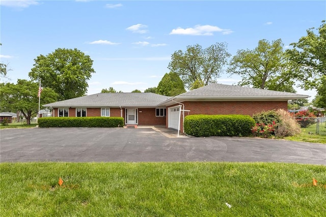814 Pardee Rd, Godfrey, IL 62035 - single story home featuring a garage, asphalt driveway, and brick siding