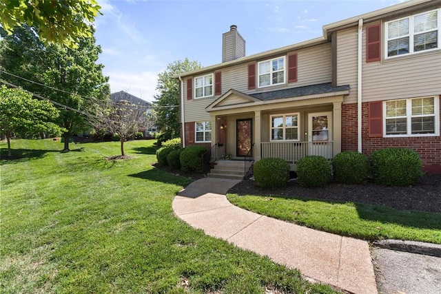 1491 Bobolink Pl, Brentwood, MO 63144 - view of front facade featuring brick siding, covered porch, a chimney, and a front lawn