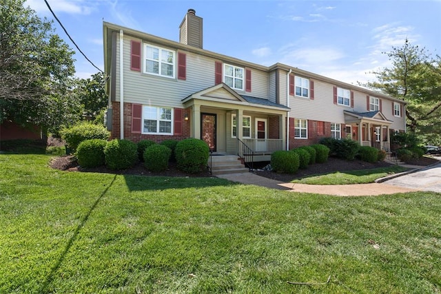 1491 Bobolink Pl, Brentwood, MO 63144 - townhome / multi-family property with covered porch, brick siding, a chimney, and a front lawn