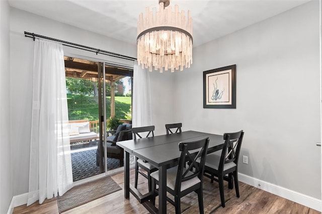 1491 Bobolink Pl, Brentwood, MO 63144 - dining room featuring a chandelier, wood finished floors, and baseboards