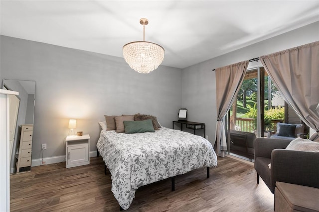 1491 Bobolink Pl, Brentwood, MO 63144 - bedroom with access to exterior, a chandelier, dark wood-style flooring, and baseboards