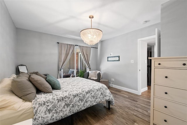 1491 Bobolink Pl, Brentwood, MO 63144 - bedroom featuring a chandelier, baseboards, and wood finished floors