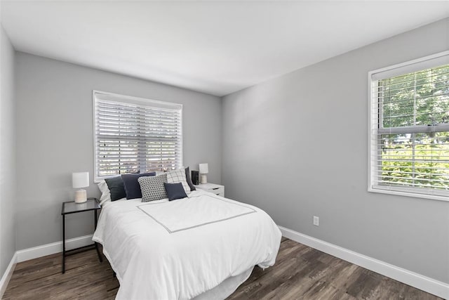 1491 Bobolink Pl, Brentwood, MO 63144 - bedroom with baseboards and dark wood-style floors