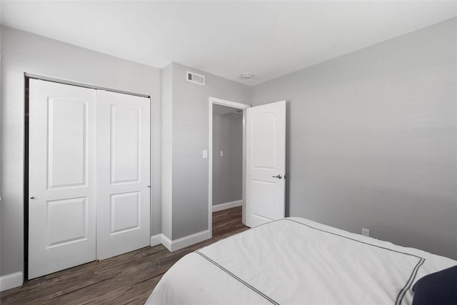 1491 Bobolink Pl, Brentwood, MO 63144 - bedroom with dark wood-style floors, a closet, and baseboards