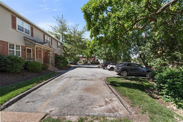 1491 Bobolink Pl, Brentwood, MO 63144 - view of asphalt road with curbs