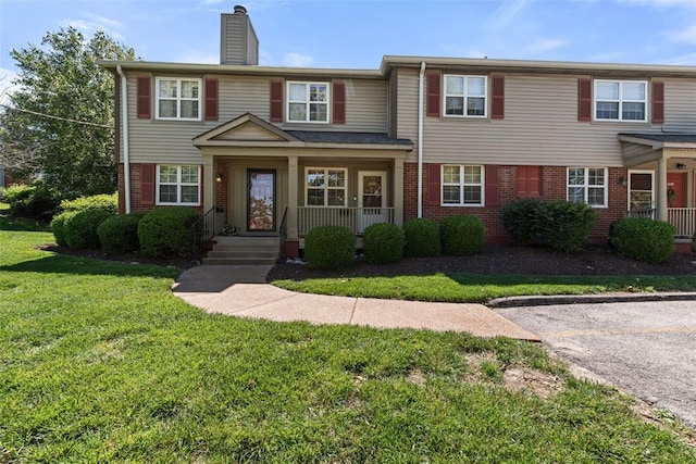 1491 Bobolink Pl, Brentwood, MO 63144 - view of front of house featuring brick siding, a porch, a front yard, and a chimney