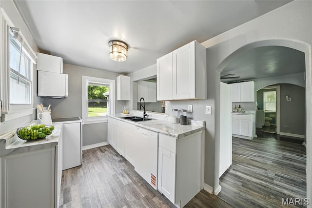 41 S Dellwood Ave, Saint Louis, MO 63135 - kitchen with white dishwasher, a sink, dark wood-style floors, and white cabinetry