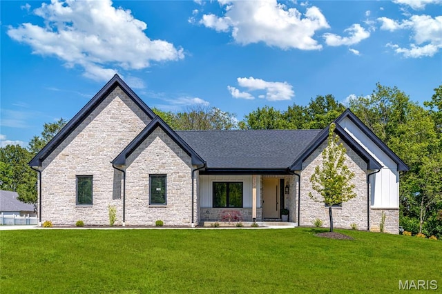 100 Enclave Terrace Ct, Weldon Spring, MO 63304 - view of front of property with stone siding, board and batten siding, and a front yard