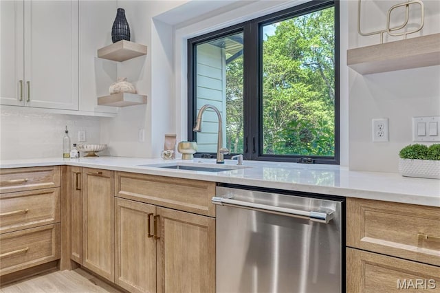 100 Enclave Terrace Ct, Weldon Spring, MO 63304 - kitchen featuring stainless steel dishwasher, open shelves, a sink, and light countertops