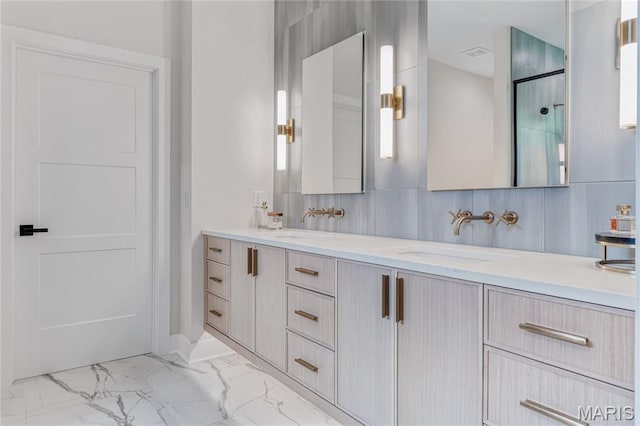 100 Enclave Terrace Ct, Weldon Spring, MO 63304 - bathroom featuring marble look tile flooring, double vanity, and an enclosed shower