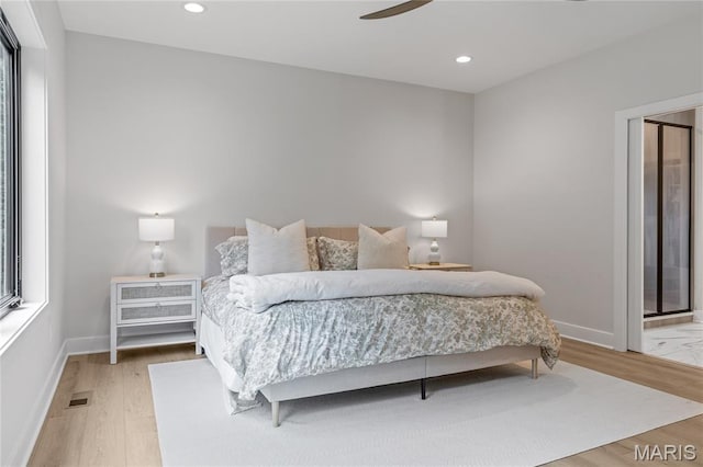 100 Enclave Terrace Ct, Weldon Spring, MO 63304 - bedroom featuring baseboards, wood finished floors, recessed lighting, and an AC wall unit