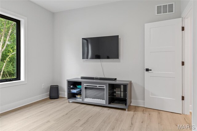 100 Enclave Terrace Ct, Weldon Spring, MO 63304 - living room with light wood-style floors and baseboards