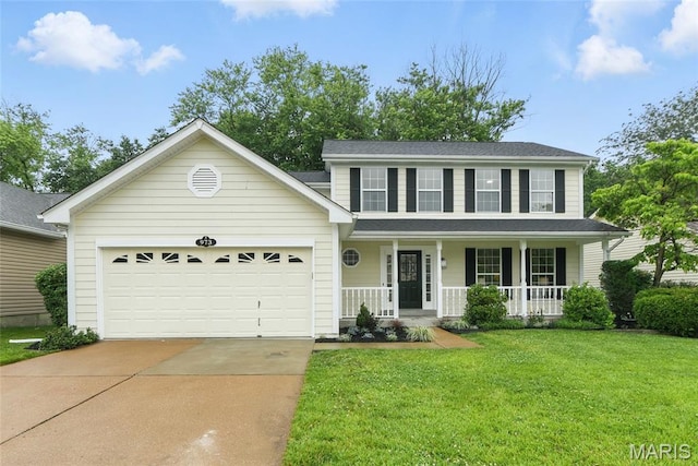 973 Kylemore Dr, Ballwin, MO 63021 - view of front of house featuring concrete driveway, a porch, a front lawn, and a garage