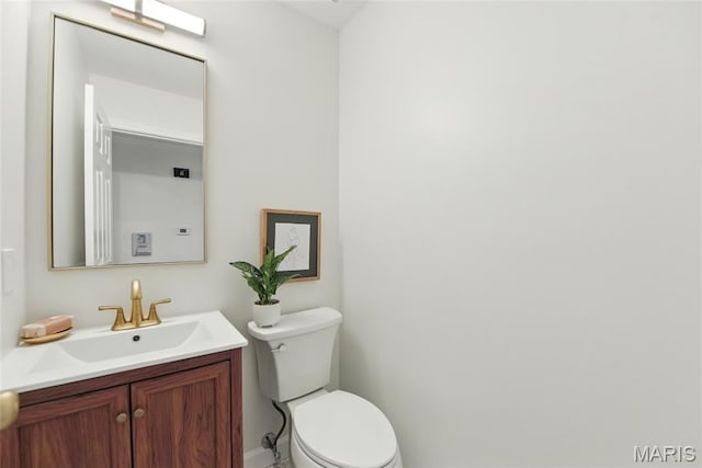 973 Kylemore Dr, Ballwin, MO 63021 - bathroom with toilet, vanity, and baseboards