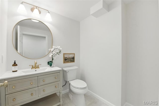 973 Kylemore Dr, Ballwin, MO 63021 - bathroom featuring toilet, vanity, and baseboards