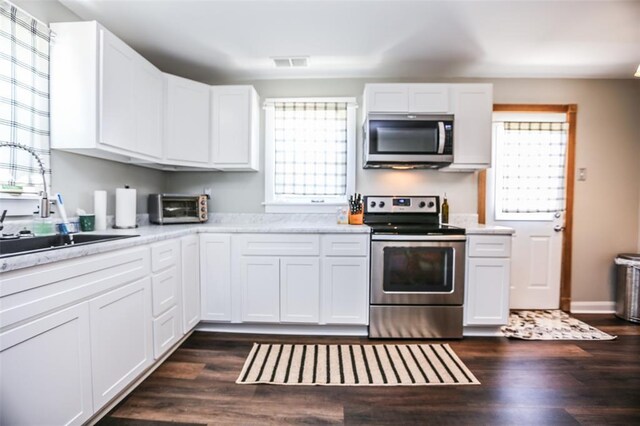 6195 Cedar Springs Rd, Cedar Hill, MO 63016 - kitchen with appliances with stainless steel finishes, healthy amount of natural light, white cabinetry, and light countertops