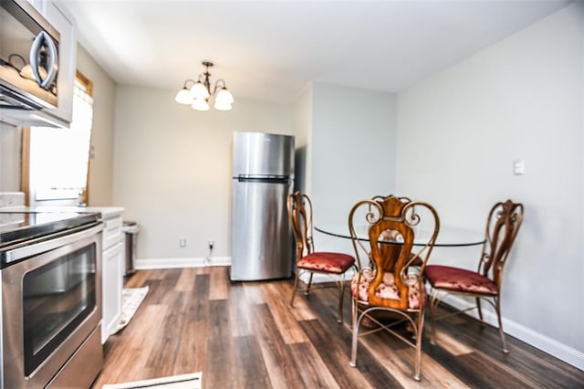 6195 Cedar Springs Rd, Cedar Hill, MO 63016 - kitchen with appliances with stainless steel finishes, a chandelier, dark wood-style floors, and baseboards